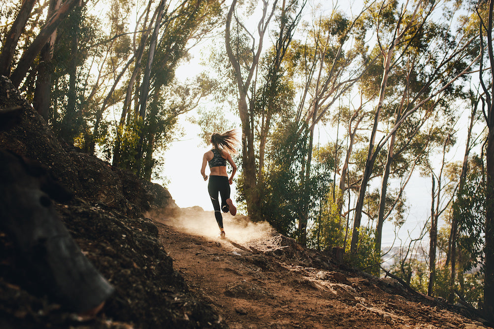 woman running in a forest