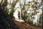 woman running in a forest